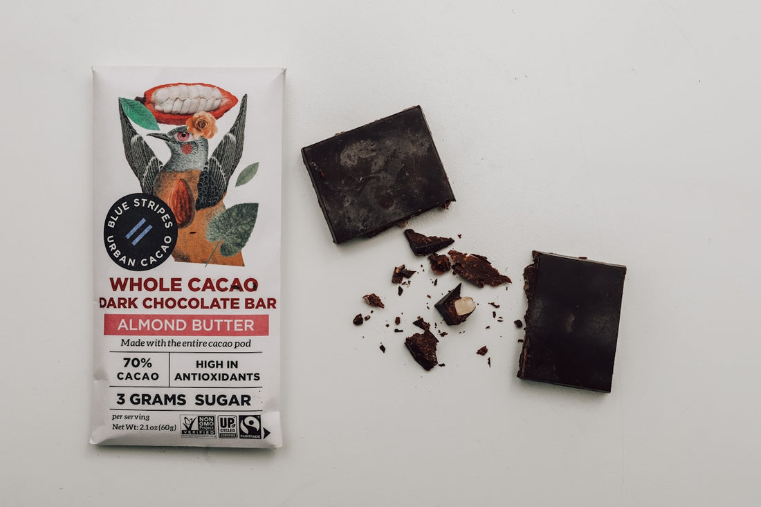 a bar of chocolate next to a broken bar of chocolate